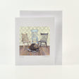 Art card from watercolour of  a beaver chewing several chair legs that he has removed from some antique chairs in the background
